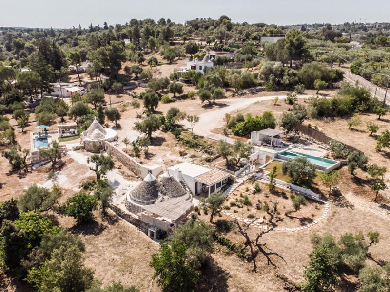 Trullo nestled in the countryside with a pool and panoramic view.